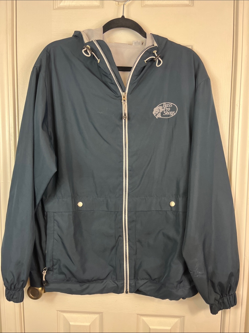 Bass Pro Shop navy blue long sleeved full zip, hooded jacket size medium.